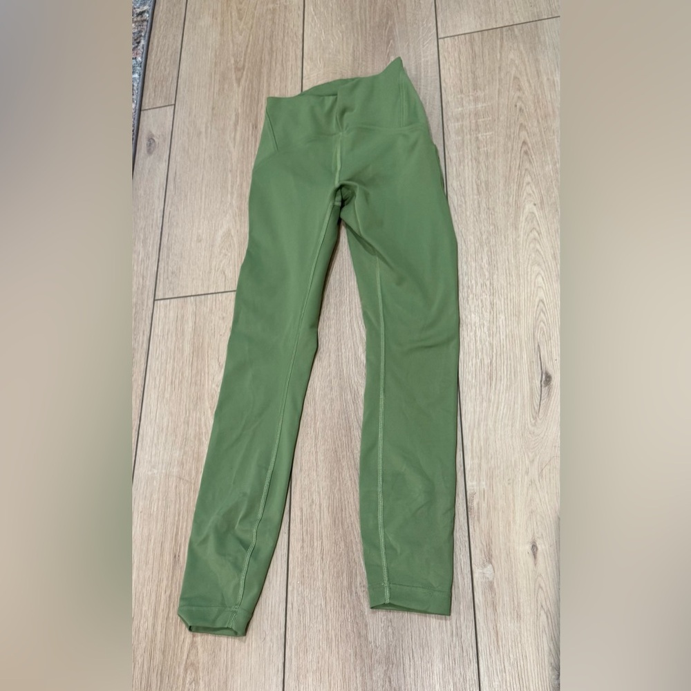 Lululemon Instill High-Rise Tight 25"
Bronze green 
Size 2
Great used condition